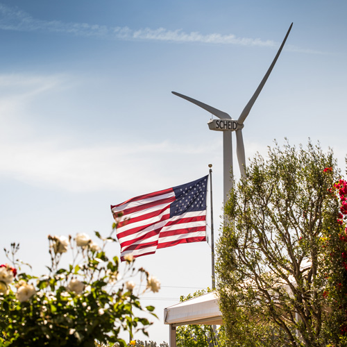 Scheid wind turbine shown with the American flag