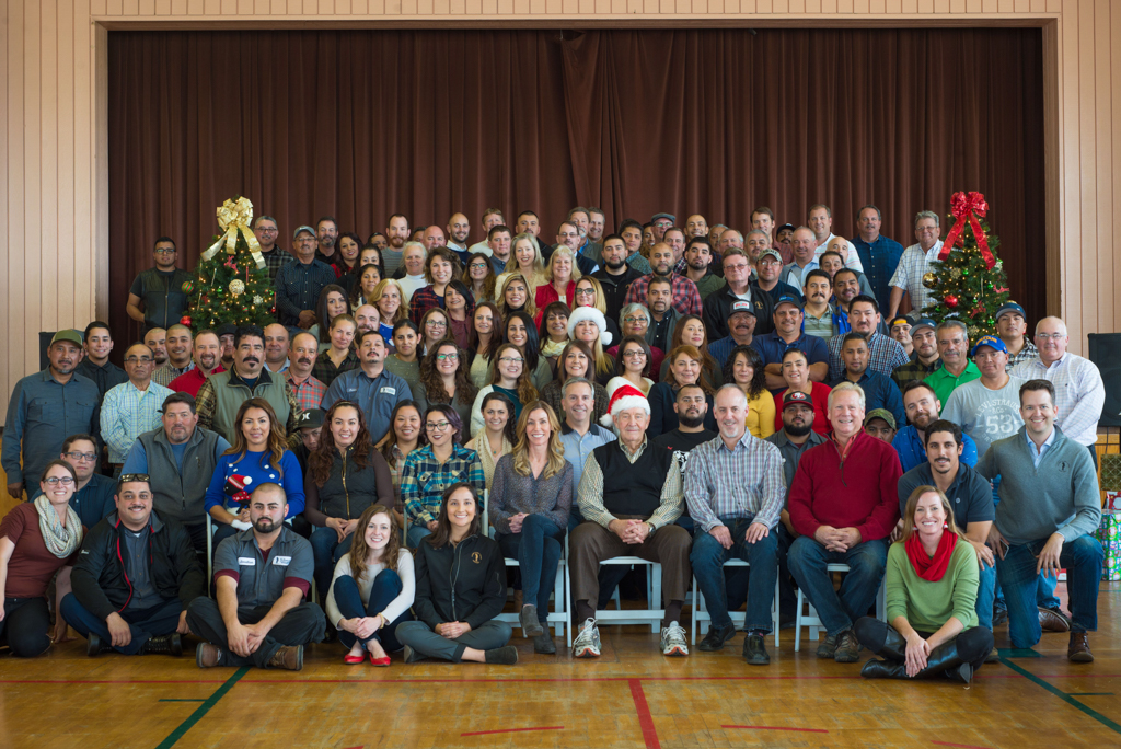 Al Scheid surrounded by the Scheid Vineyards family and employees