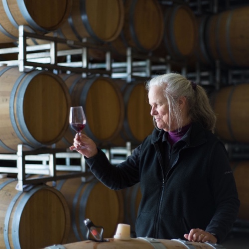 Winemaker Marta Kraftzeck examining wine inside a glass