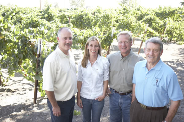 Vineyard team at Scheid Vineyards in California, showcasing wine production excellence.