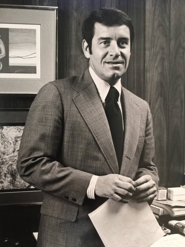 Portrait of a man in a suit at Scheid Vineyards, showcasing vineyard hospitality and wine production.
