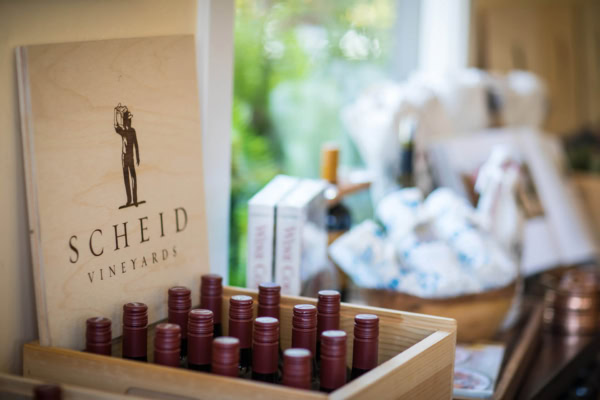 Vineyard wine bottles at Scheid Vineyards, showcasing premium wine production and wine tasting experience.