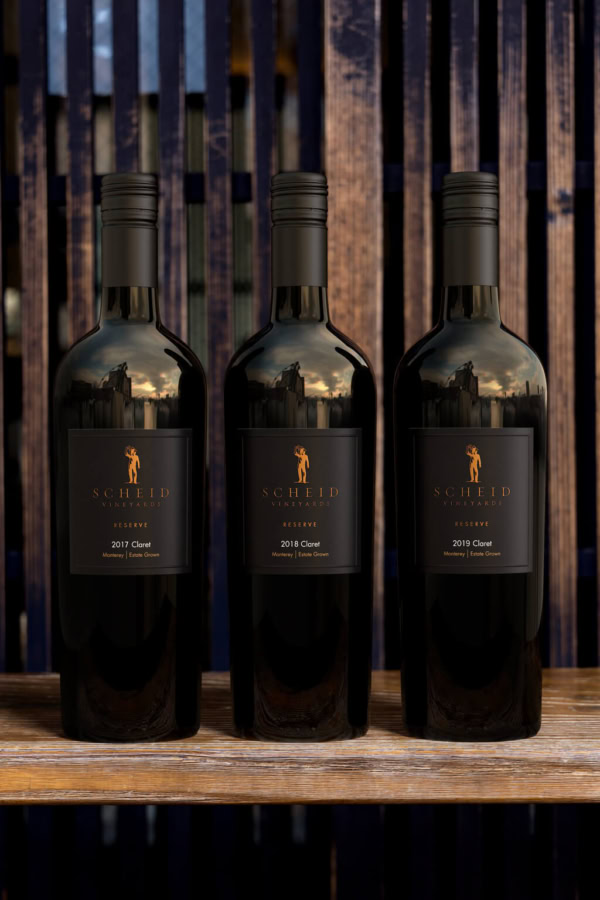 1. Bottles of Scheid Vineyards Reserve Claret wine on display.