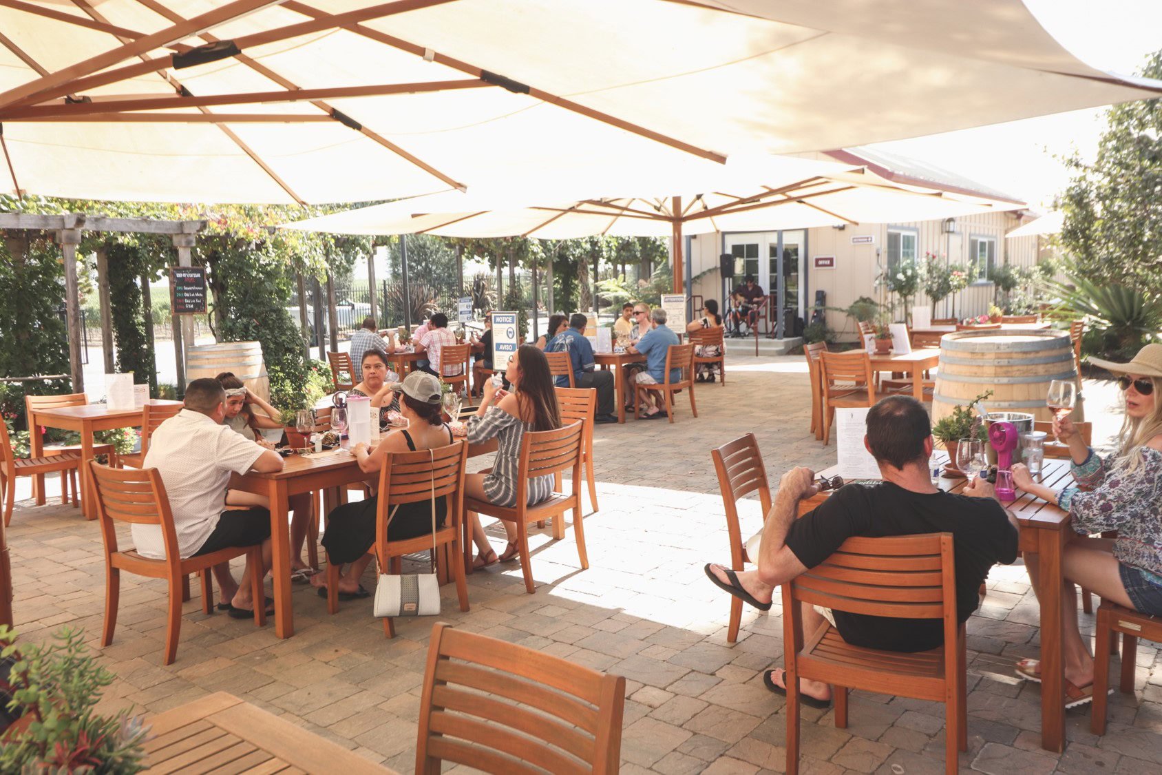 Alameda outdoor dining at Scheid Vineyards Wine Tasting Room and Restaurant in California.