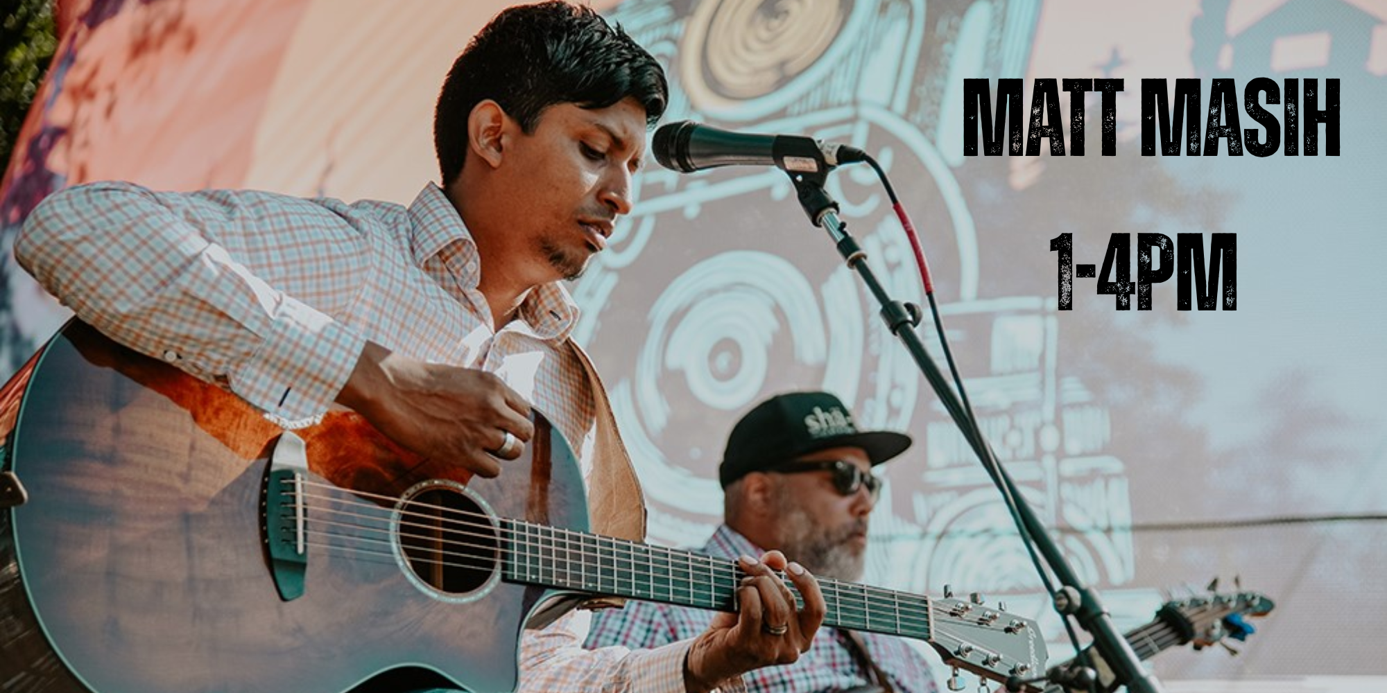 Matt Masih performing guitar during live music event at Scheid Vineyards.