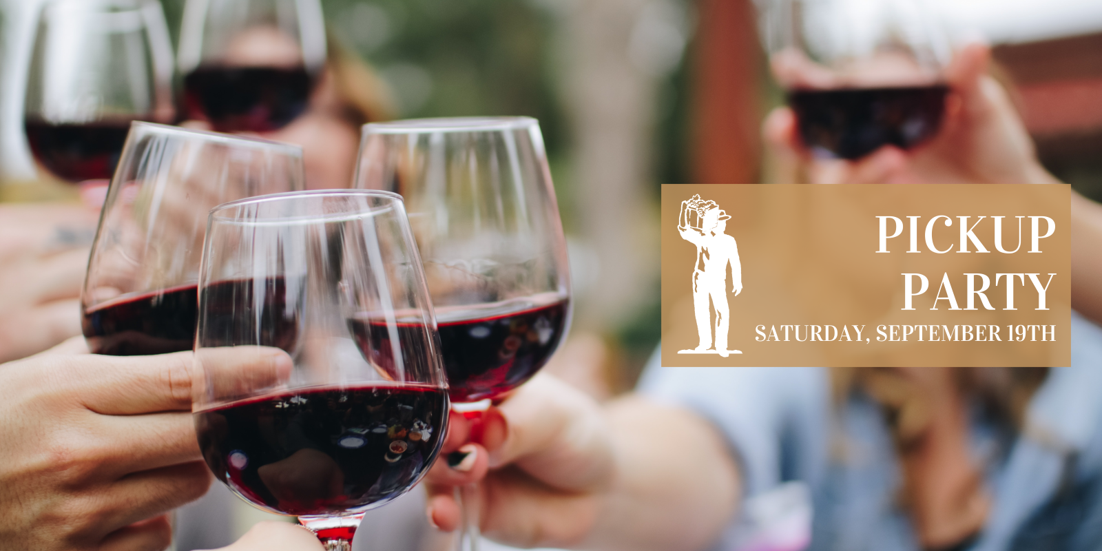 People clinking glasses of red wine at Scheid Vineyards pickup party.